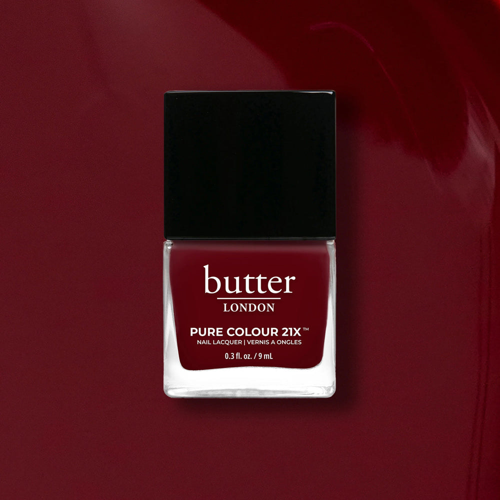 Butter London nail polish bottle on a red background