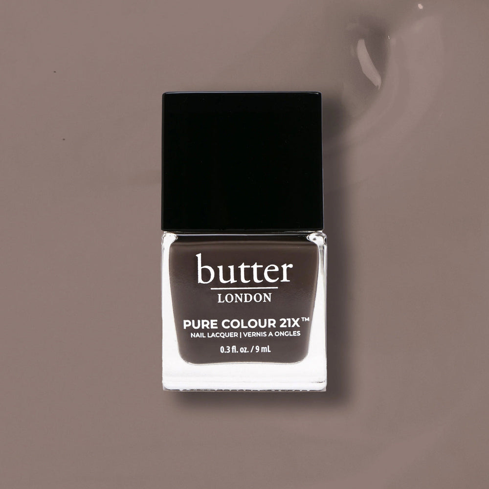 Butter London nail polish bottle on a taupe background
